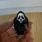 SPOOKY CHARACTER BADGE REELS